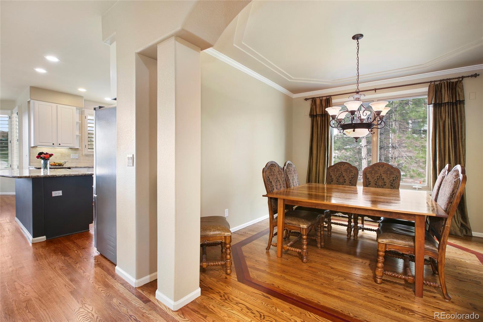 7768 Edgewater Court Lone Tree, CO 80124 - Photo 13 of 39 a view of a dining room with furniture window and outside view