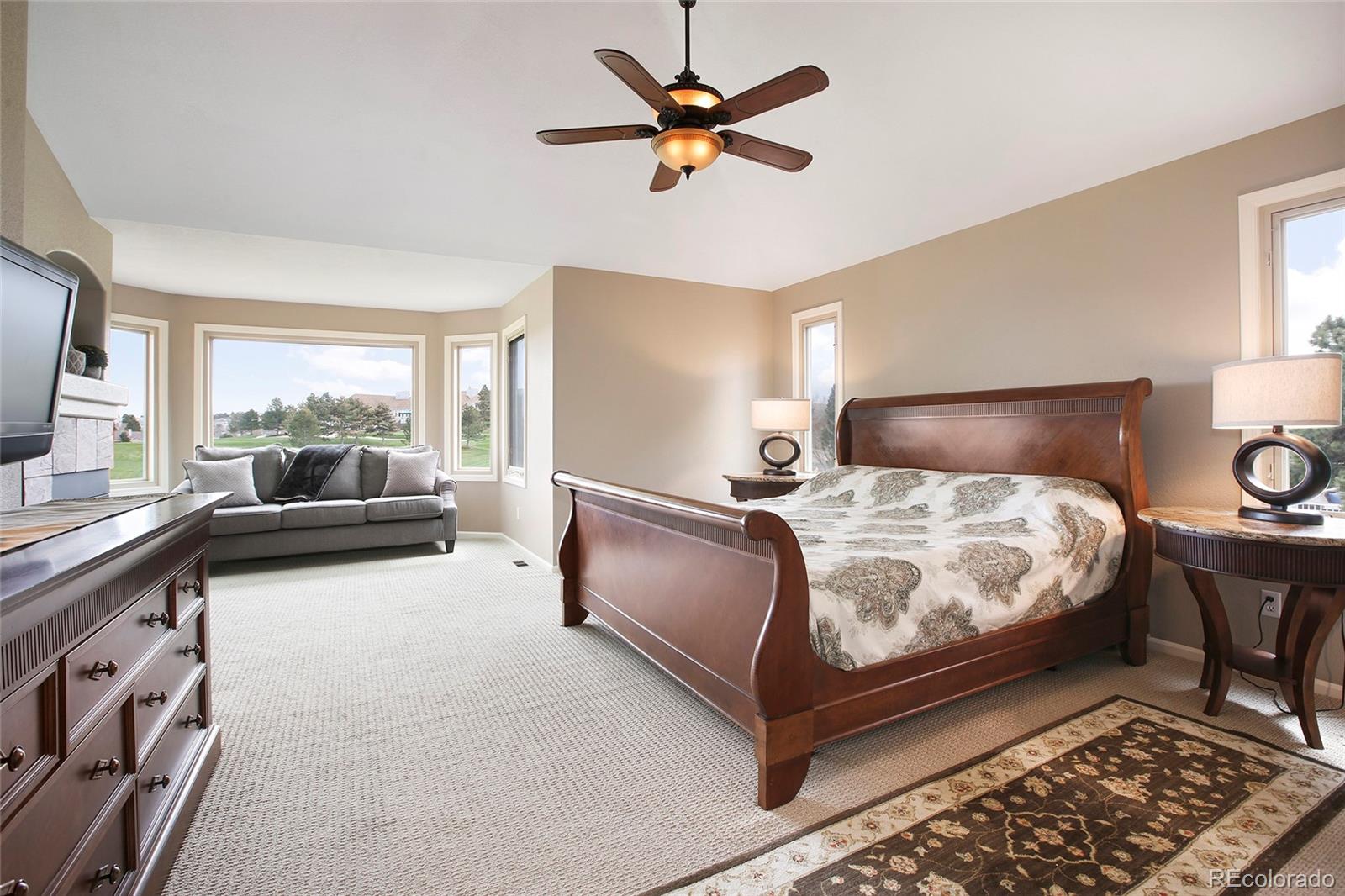 7768 Edgewater Court Lone Tree, CO 80124 - Photo 16 of 39 a bedroom with bed and window