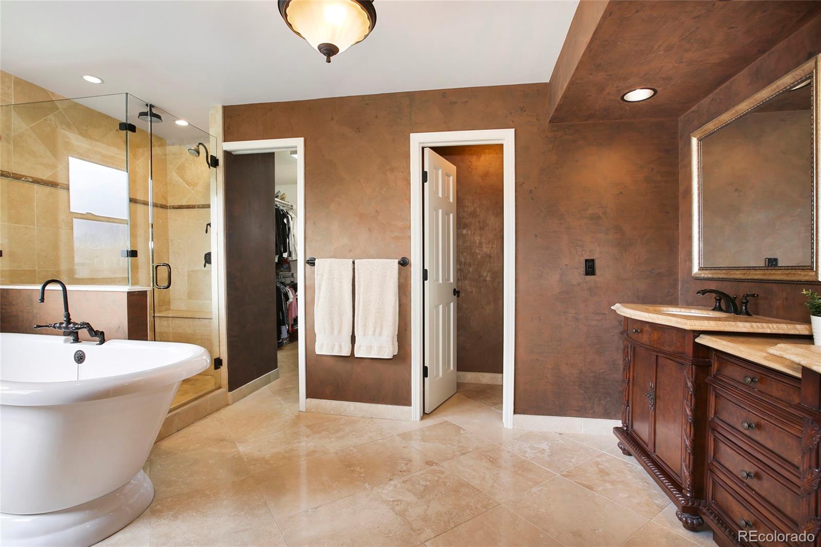 7768 Edgewater Court Lone Tree, CO 80124 - Photo 17 of 39 a bathroom with a sink and a mirror