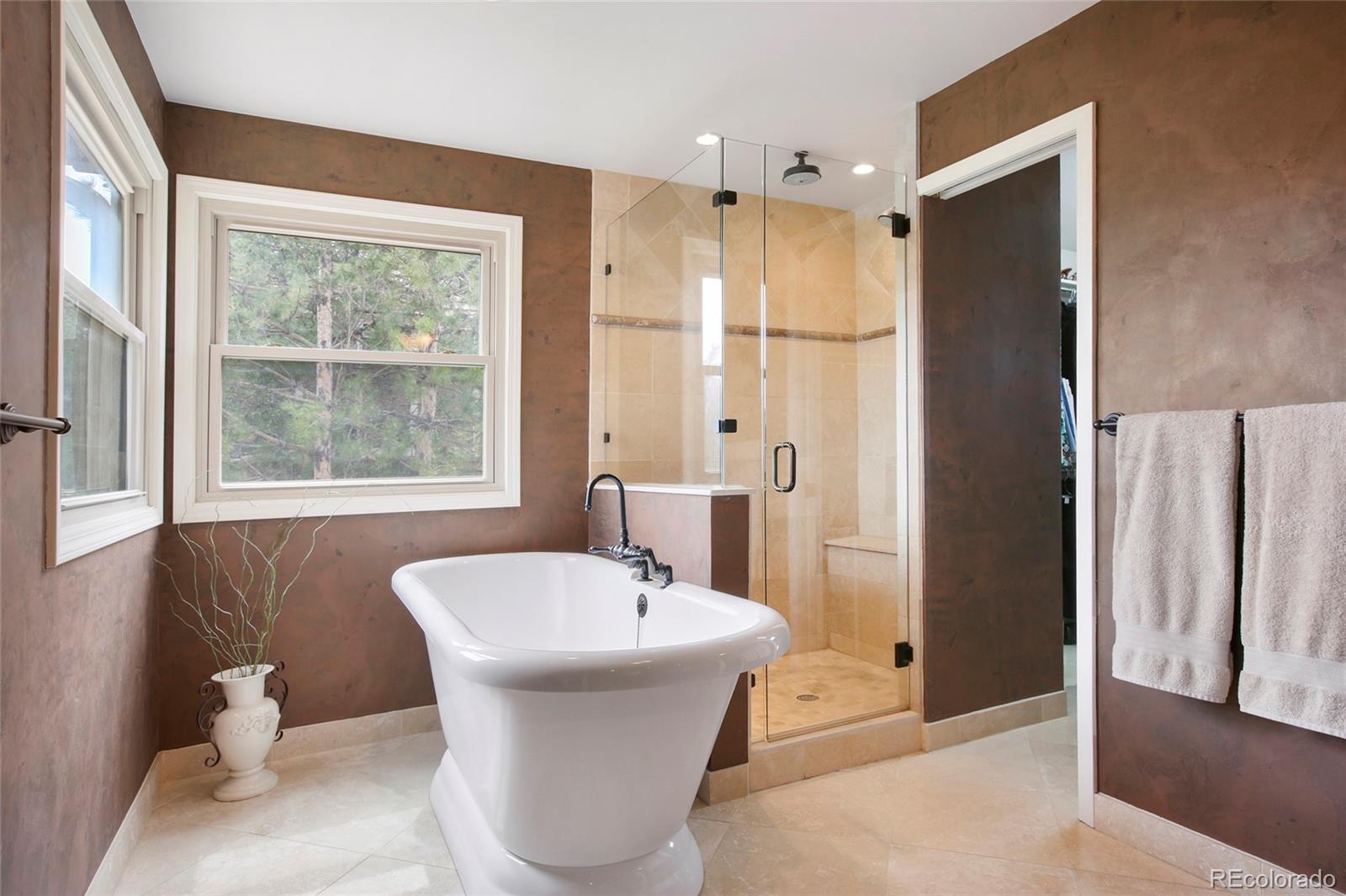 7768 Edgewater Court Lone Tree, CO 80124 - Photo 19 of 39 a bathroom with a bathtub and a sink