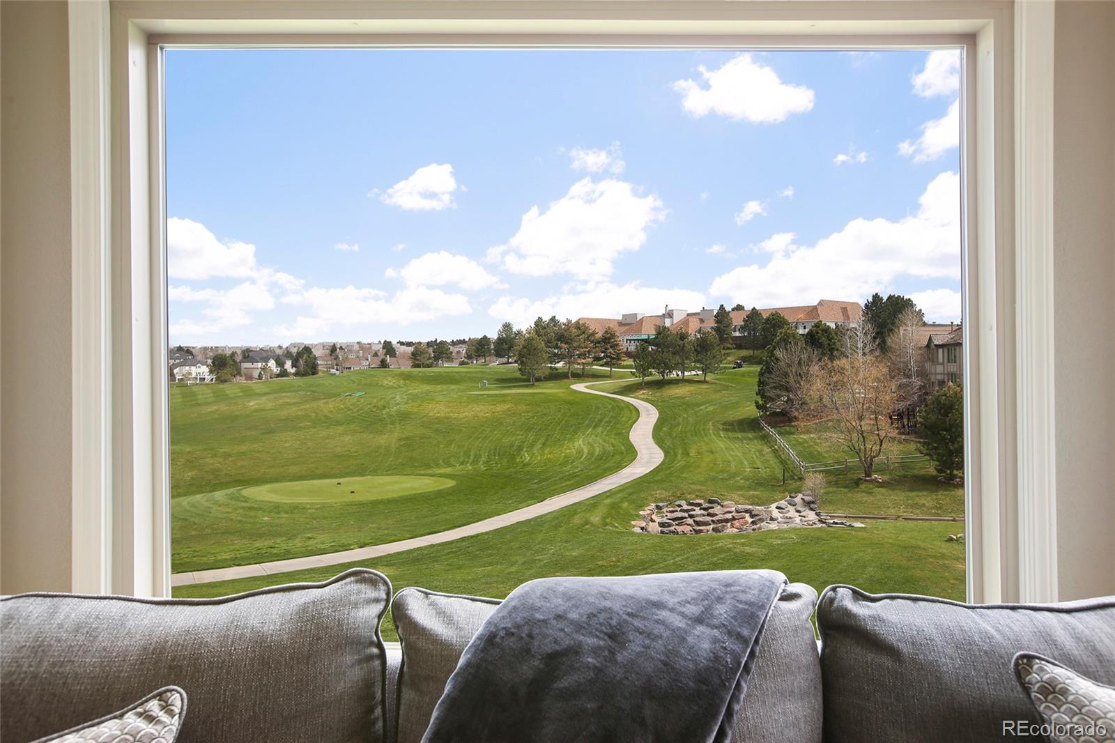 7768 Edgewater Court Lone Tree, CO 80124 - Photo 20 of 39 a view of a city from a balcony