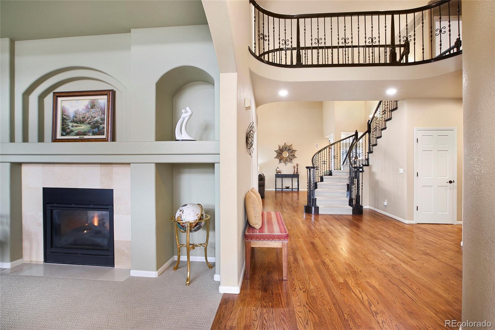 7768 Edgewater Court Lone Tree, CO 80124 - Photo 3 of 39 a view of livingroom with furniture and wooden floor