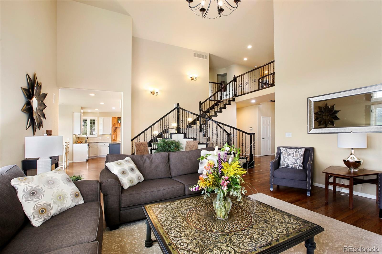 7768 Edgewater Court Lone Tree, CO 80124 - Photo 6 of 39 a living room with furniture and wooden floor