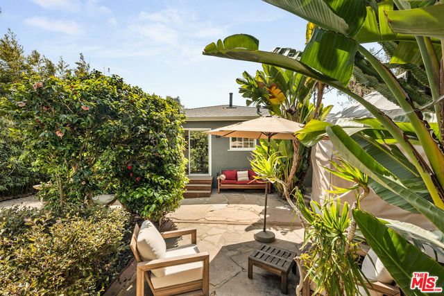 a view of a chairs and table in a patio