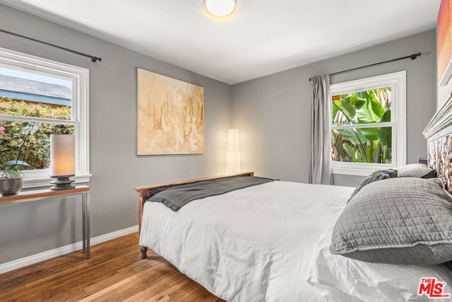 a bathroom with a sink a toilet and a window