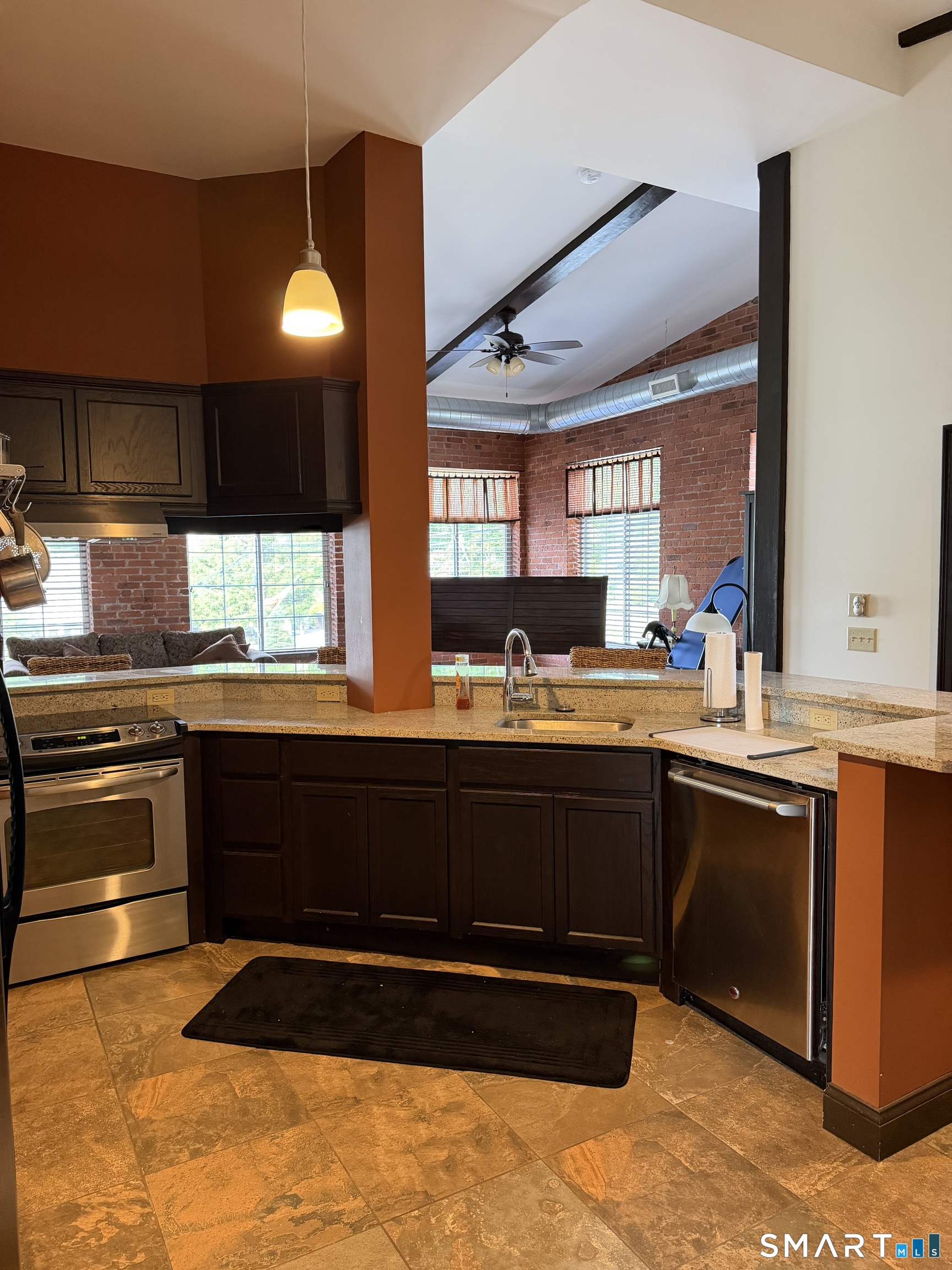 10 Summit Street, Unit 1 East Hampton, CT 06424 - Photo 3 of 14 a kitchen with stainless steel appliances granite countertop a stove a sink and a microwave