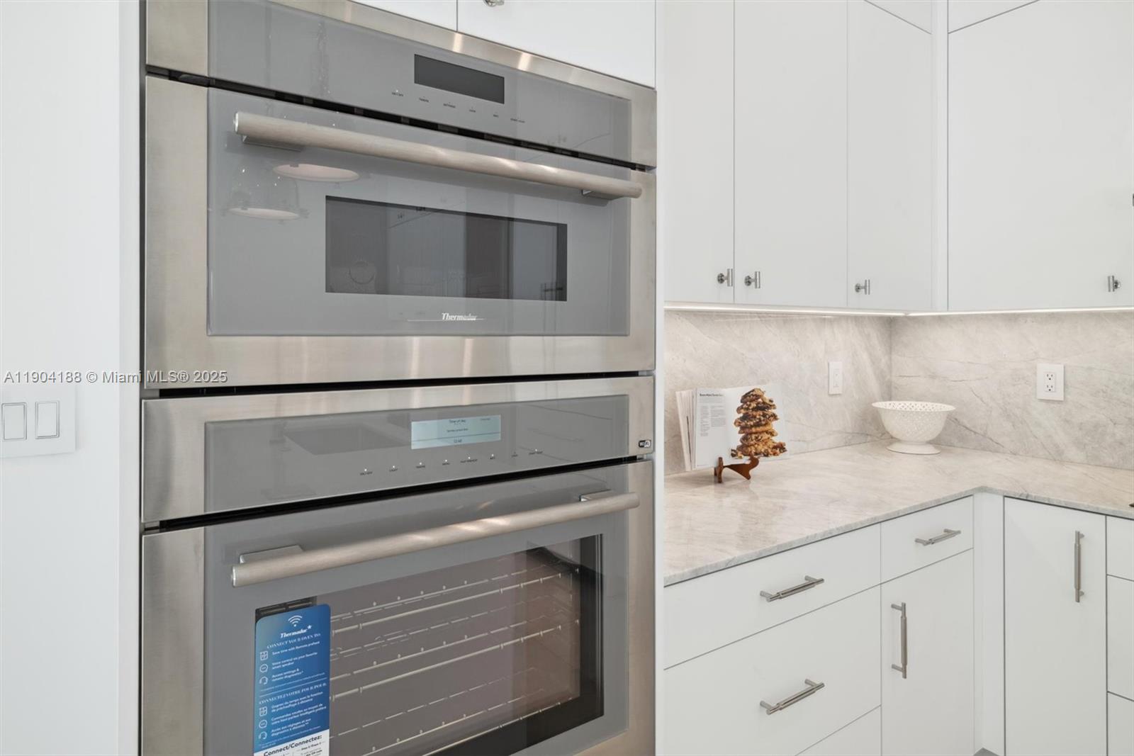 554 North Riverside Drive, Unit B Pompano Beach, FL 33062 - Photo 14 of 48 a kitchen with appliances and cabinets