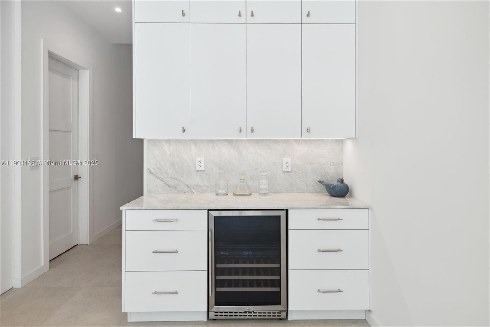 554 North Riverside Drive, Unit B Pompano Beach, FL 33062 - Photo 19 of 48 a view of cabinets with washer and dryer