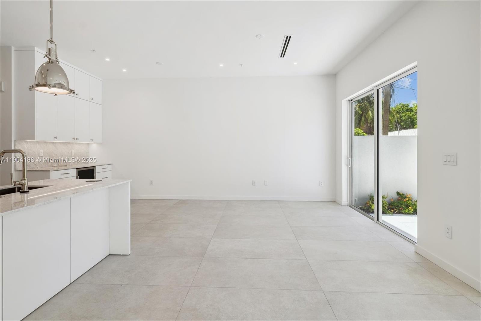 554 North Riverside Drive, Unit B Pompano Beach, FL 33062 - Photo 20 of 48 a view of a kitchen with sink and white cabinets