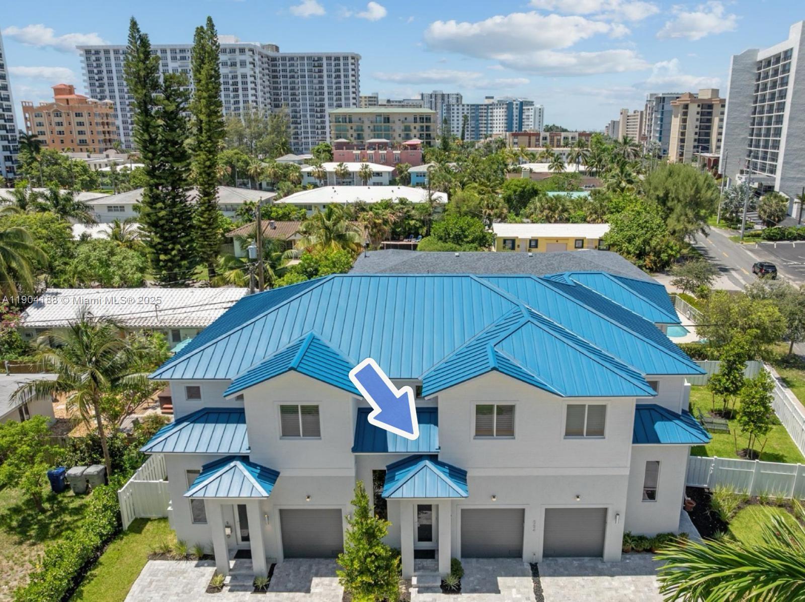 554 North Riverside Drive, Unit B Pompano Beach, FL 33062 - Photo 2 of 48 a aerial view of a house next to a yard