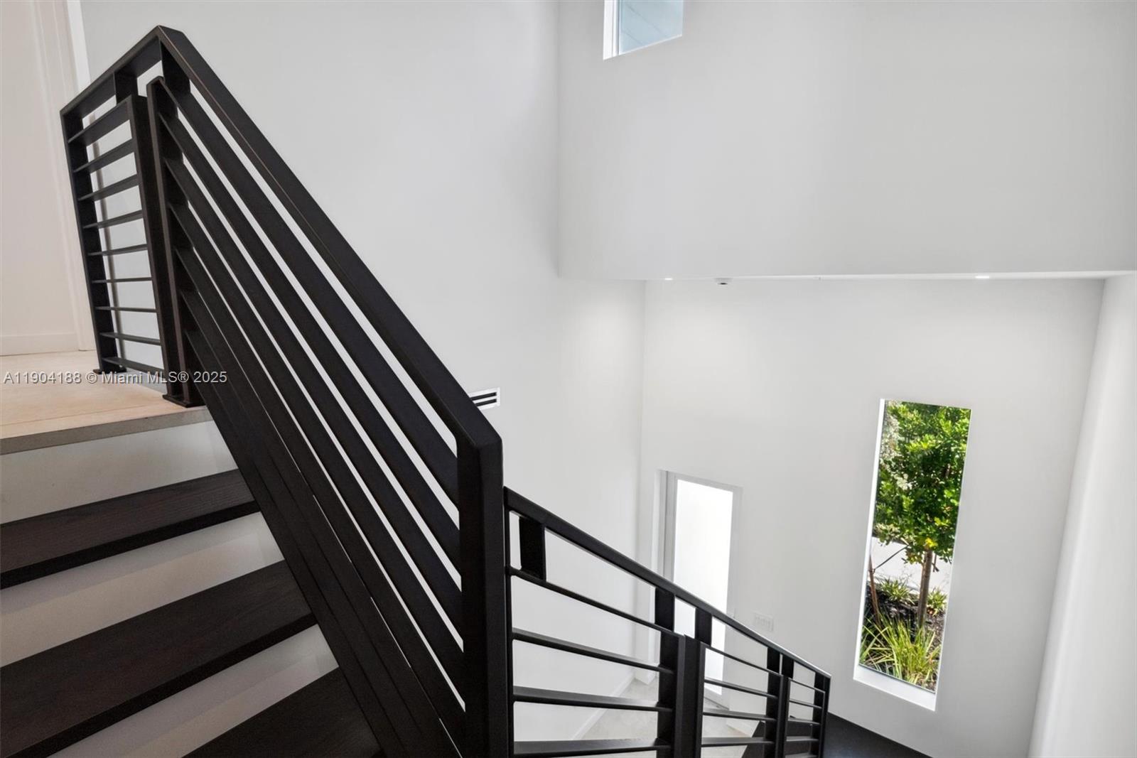 554 North Riverside Drive, Unit B Pompano Beach, FL 33062 - Photo 26 of 48 a view of staircase with wooden floor