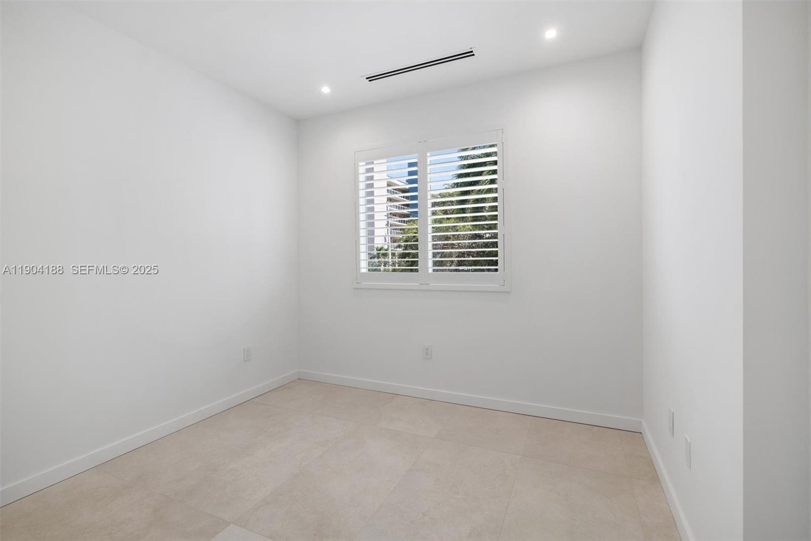 554 North Riverside Drive, Unit B Pompano Beach, FL 33062 - Photo 28 of 48 a view of an empty room with a window