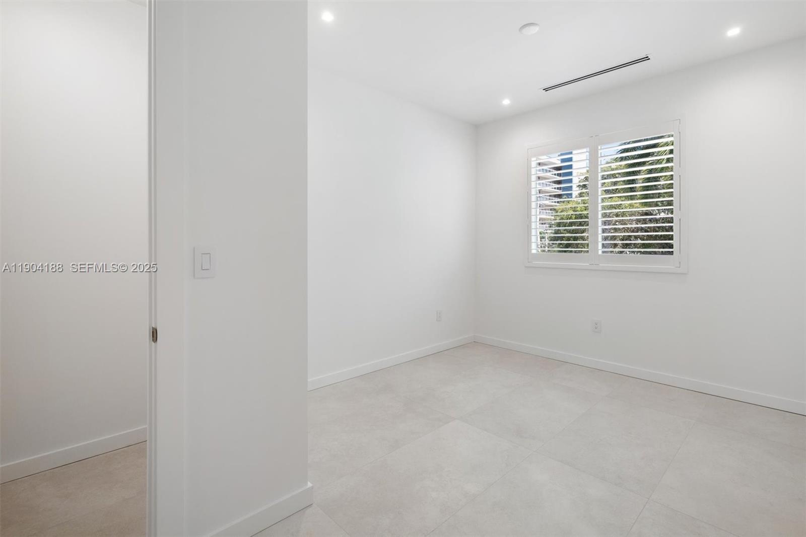 554 North Riverside Drive, Unit B Pompano Beach, FL 33062 - Photo 30 of 48 a view of an empty room with a window