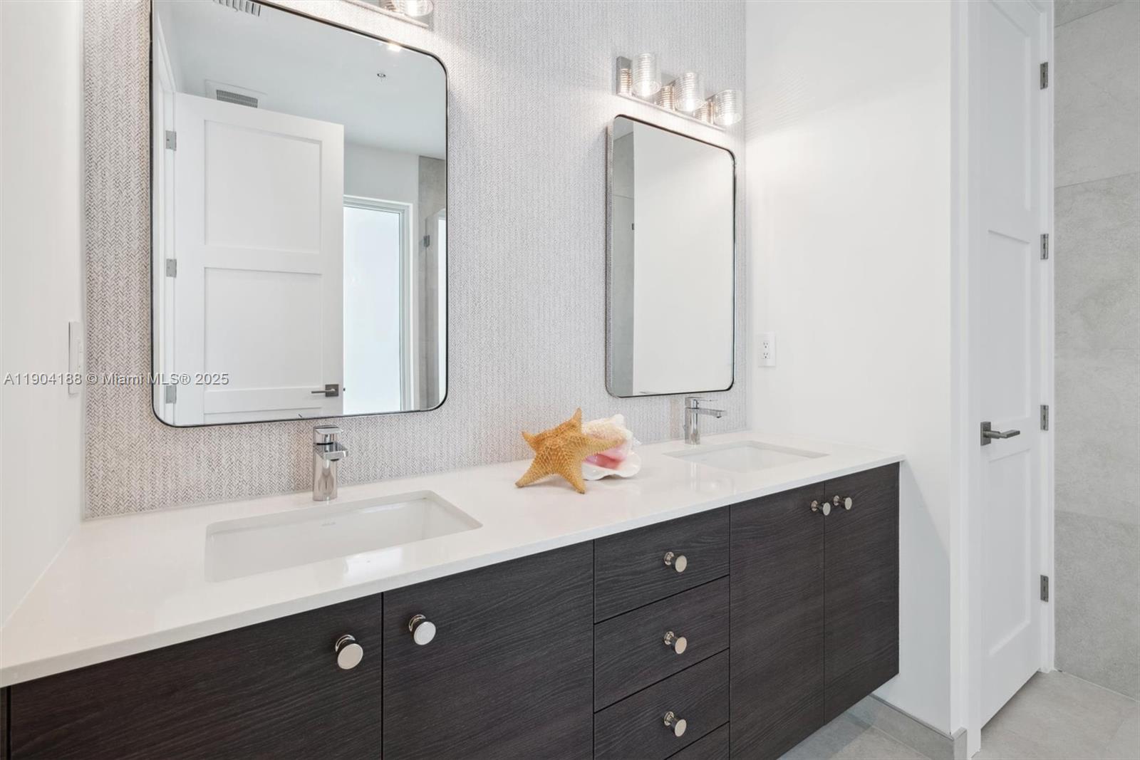 554 North Riverside Drive, Unit B Pompano Beach, FL 33062 - Photo 40 of 48 a bathroom with a double vanity sink mirror and