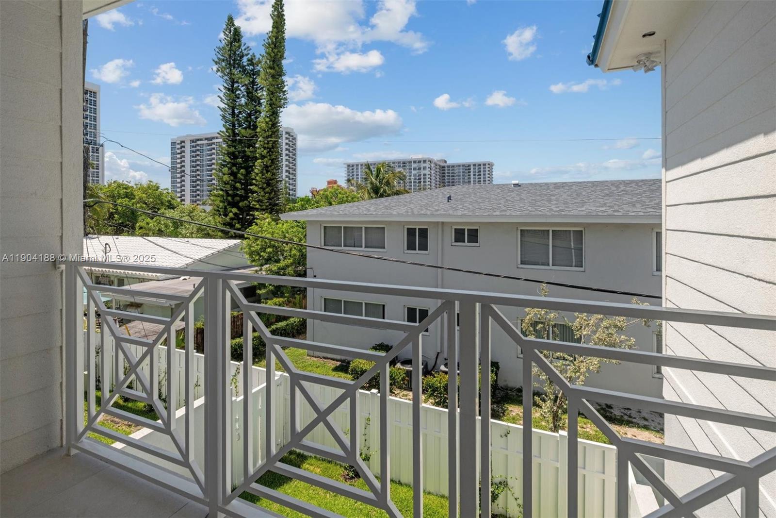 554 North Riverside Drive, Unit B Pompano Beach, FL 33062 - Photo 44 of 48 a view of a house with wooden deck and furniture