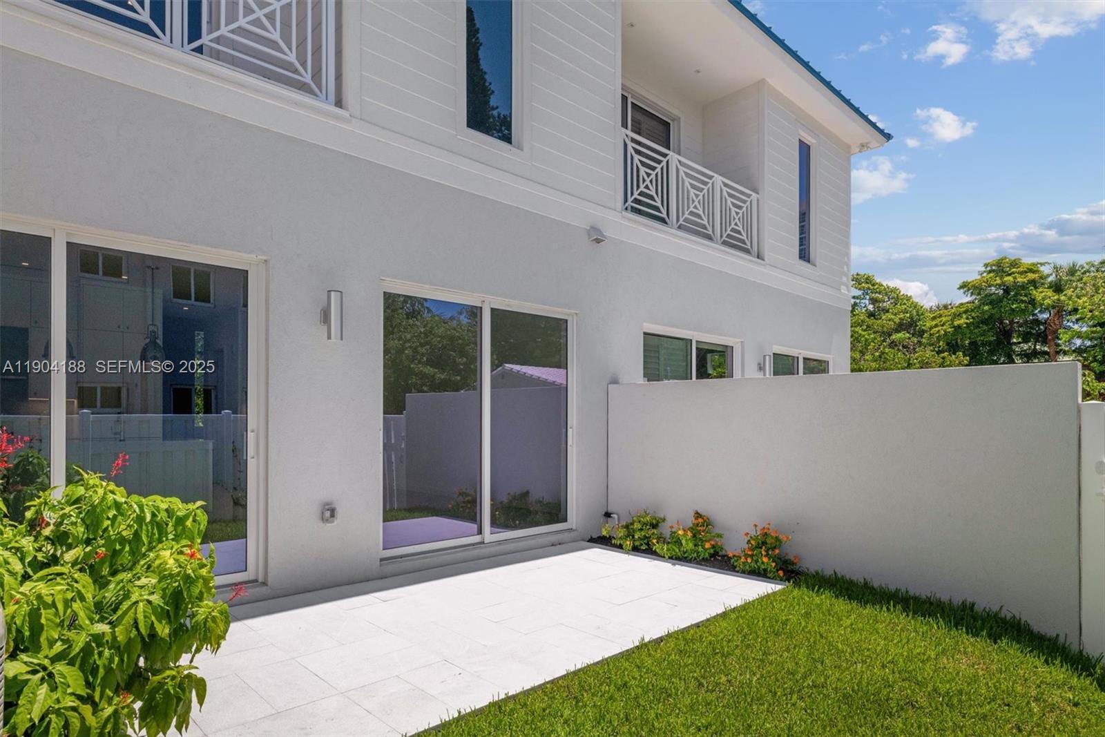 554 North Riverside Drive, Unit B Pompano Beach, FL 33062 - Photo 48 of 48 a front view of a house with a yard