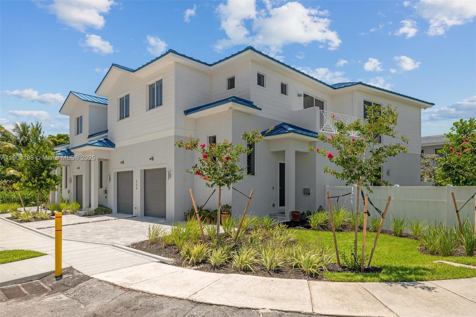 554 North Riverside Drive, Unit B Pompano Beach, FL 33062 - Photo 6 of 48 a front view of a house with a yard