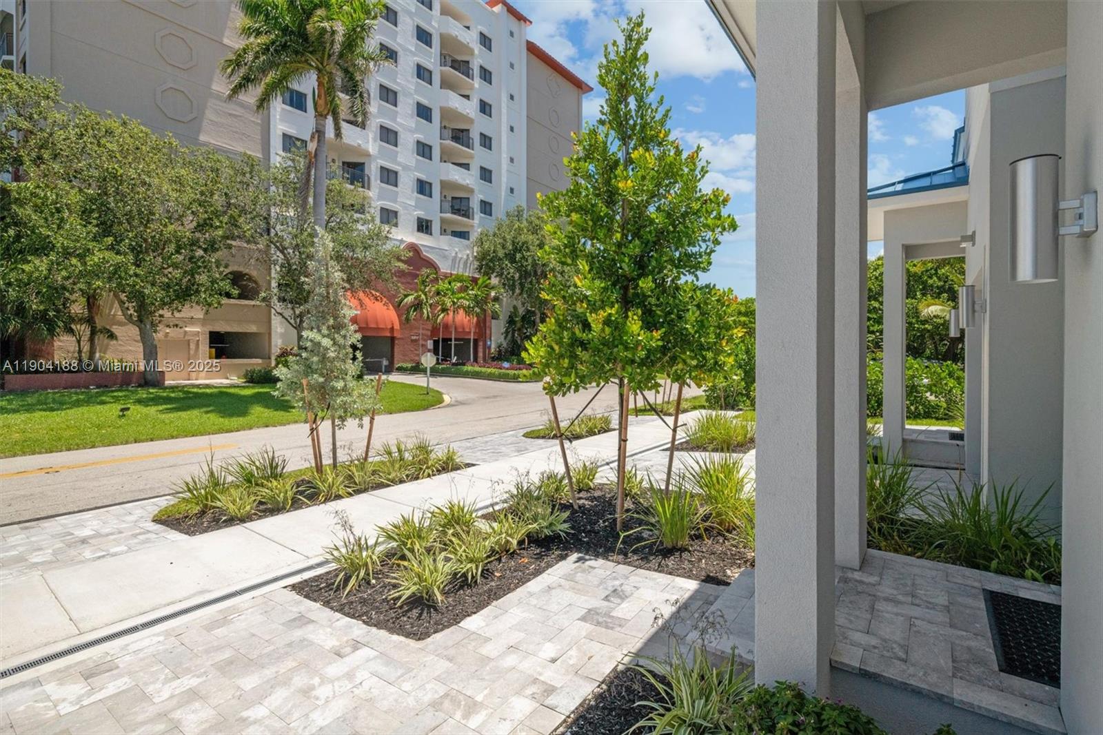 554 North Riverside Drive, Unit B Pompano Beach, FL 33062 - Photo 9 of 48 a view of a garden with a bench