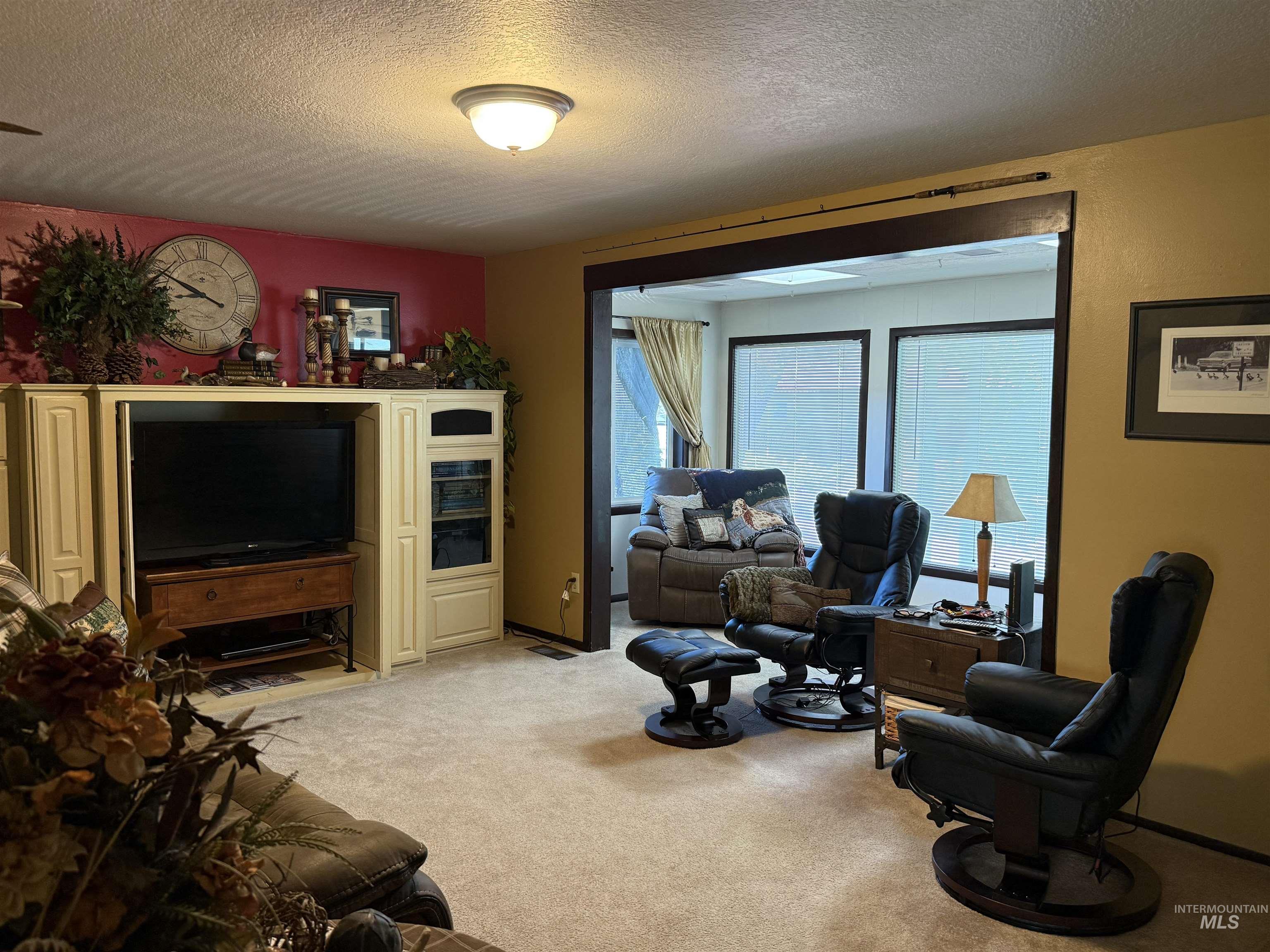 403 138th Street Orofino, ID 83544 - Photo 16 of 32 Living room with light colored carpet and a textured ceiling