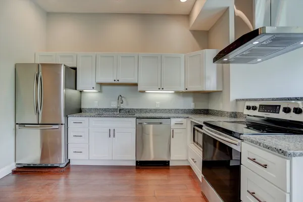 a view of a kitchen with a sink and dishwasher