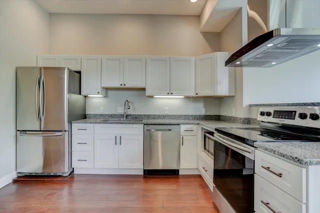 a view of a kitchen with a sink and dishwasher