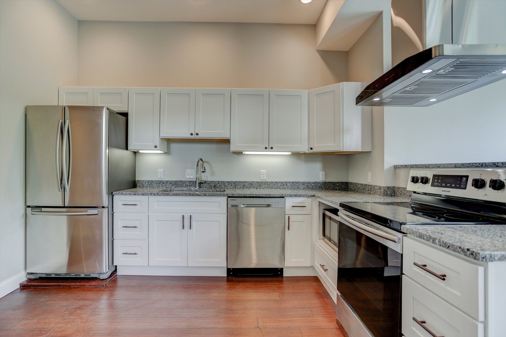 218 West Main Street Urbana, IL 61801 - Photo 11 of 96 a kitchen with stainless steel appliances granite countertop a stove a refrigerator and a granite counter tops