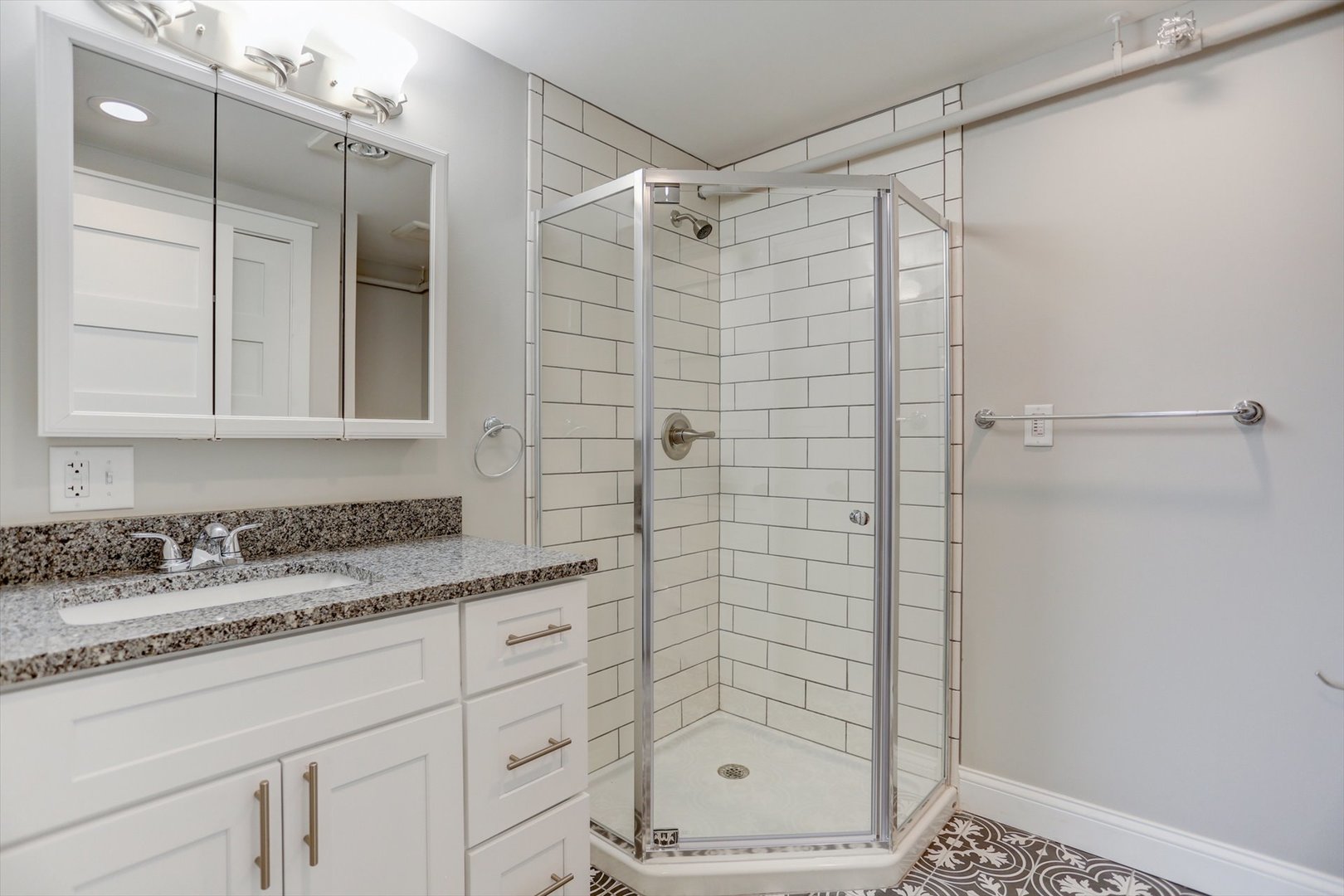 218 West Main Street Urbana, IL 61801 - Photo 20 of 96 a bathroom with a shower sink and mirror
