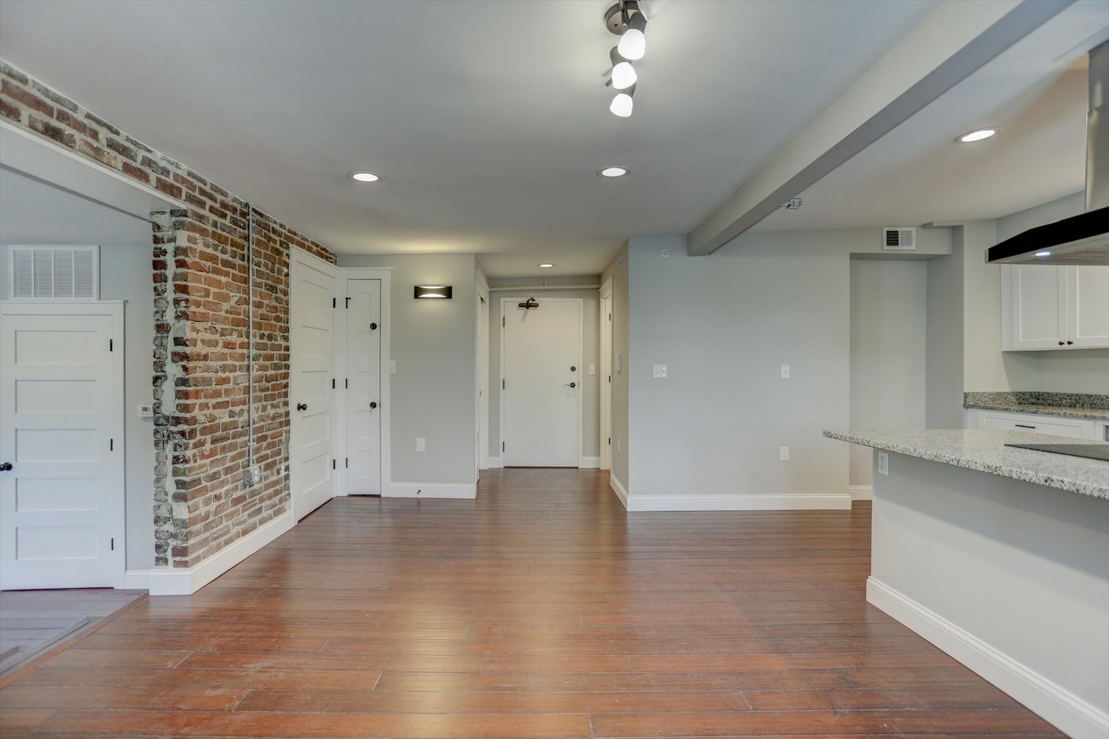 218 West Main Street Urbana, IL 61801 - Photo 48 of 96 a view of a hallway with wooden floor and a living room