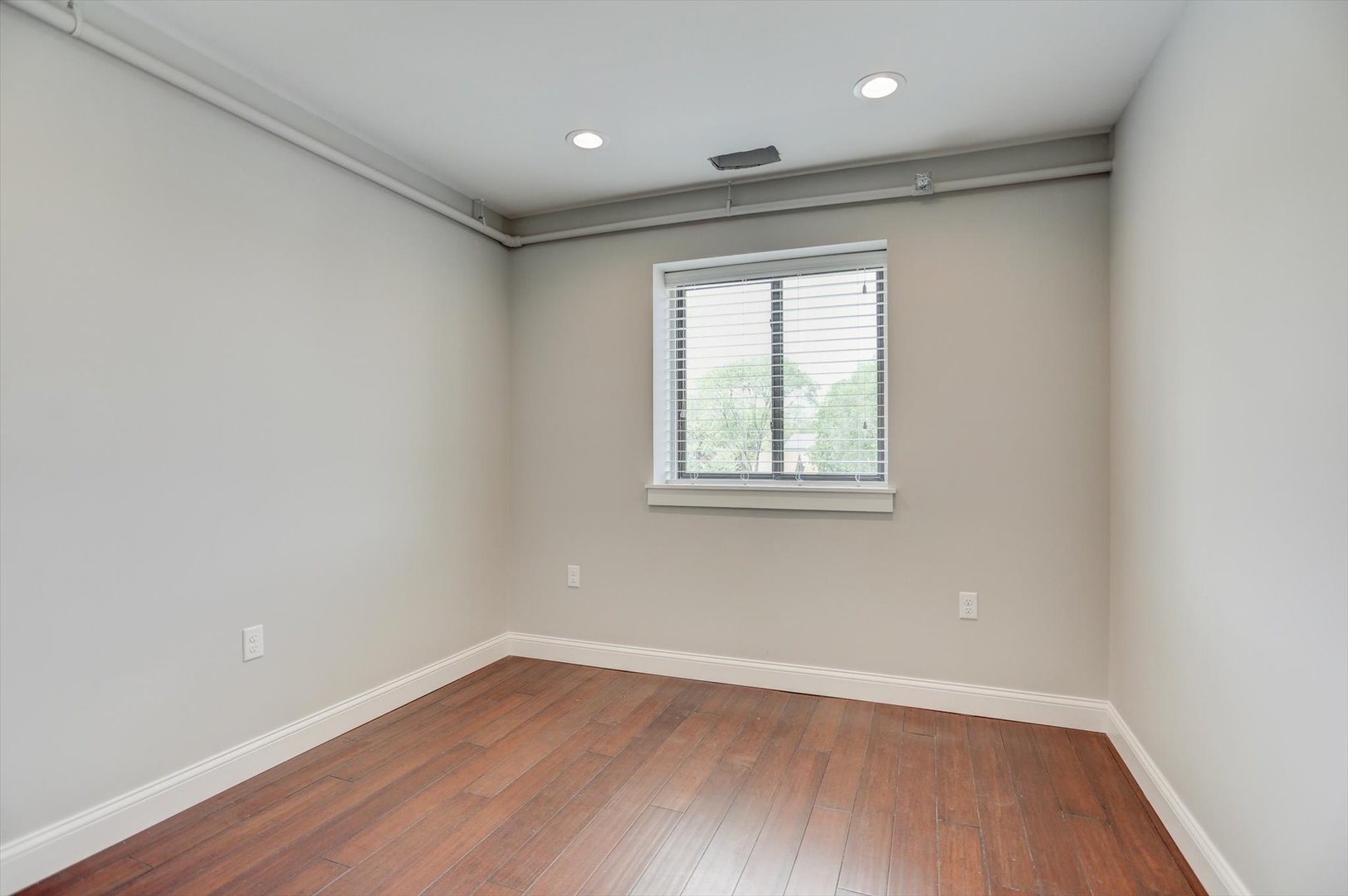 218 West Main Street Urbana, IL 61801 - Photo 53 of 96 wooden floor in an empty room with a window