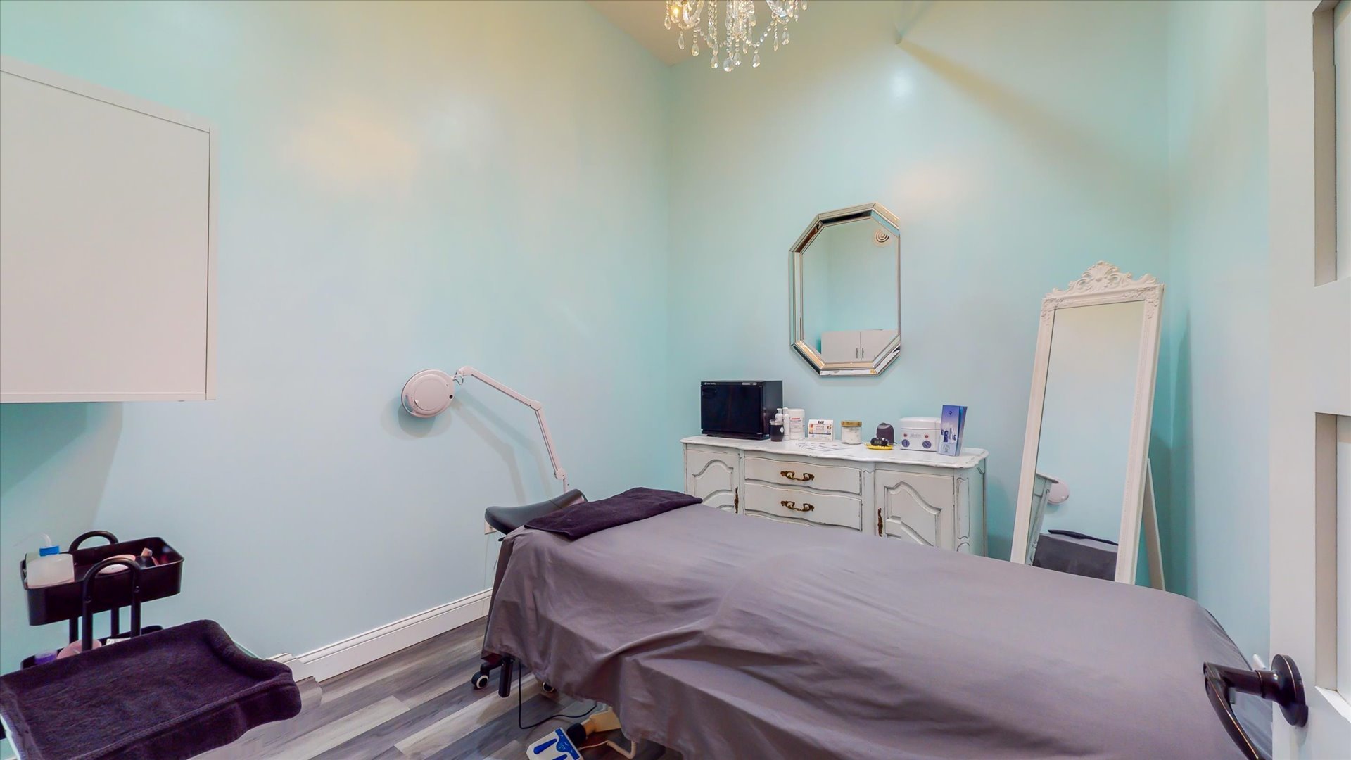 218 West Main Street Urbana, IL 61801 - Photo 81 of 96 a bedroom with a bed table and a chandelier