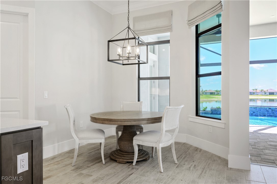 18377 Ridgeline Drive Estero, FL 33928 - Photo 19 of 50 a view of a dining room with furniture window and outside view