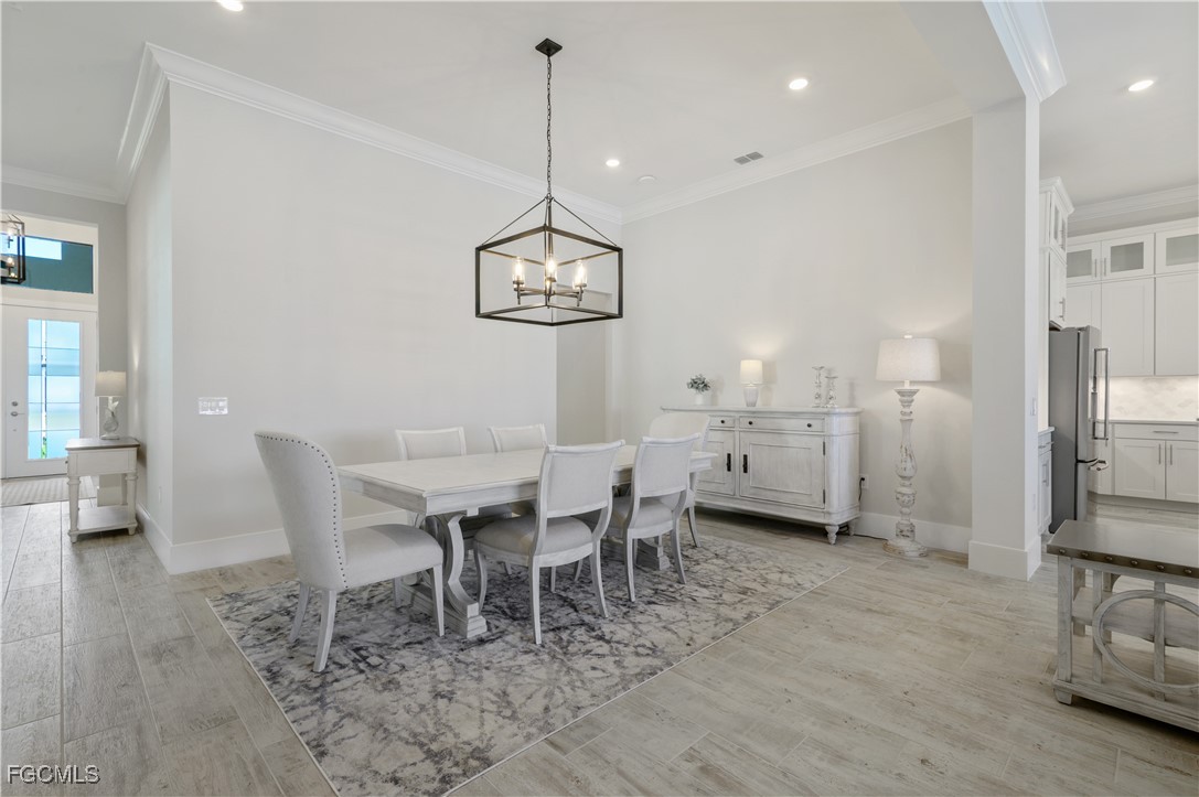 18377 Ridgeline Drive Estero, FL 33928 - Photo 21 of 50 a view of a dining room with furniture