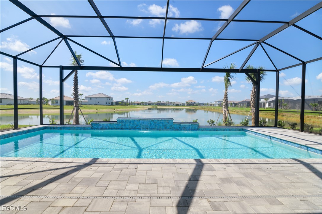 18377 Ridgeline Drive Estero, FL 33928 - Photo 25 of 50 a view of a tennis court with an outdoor seating