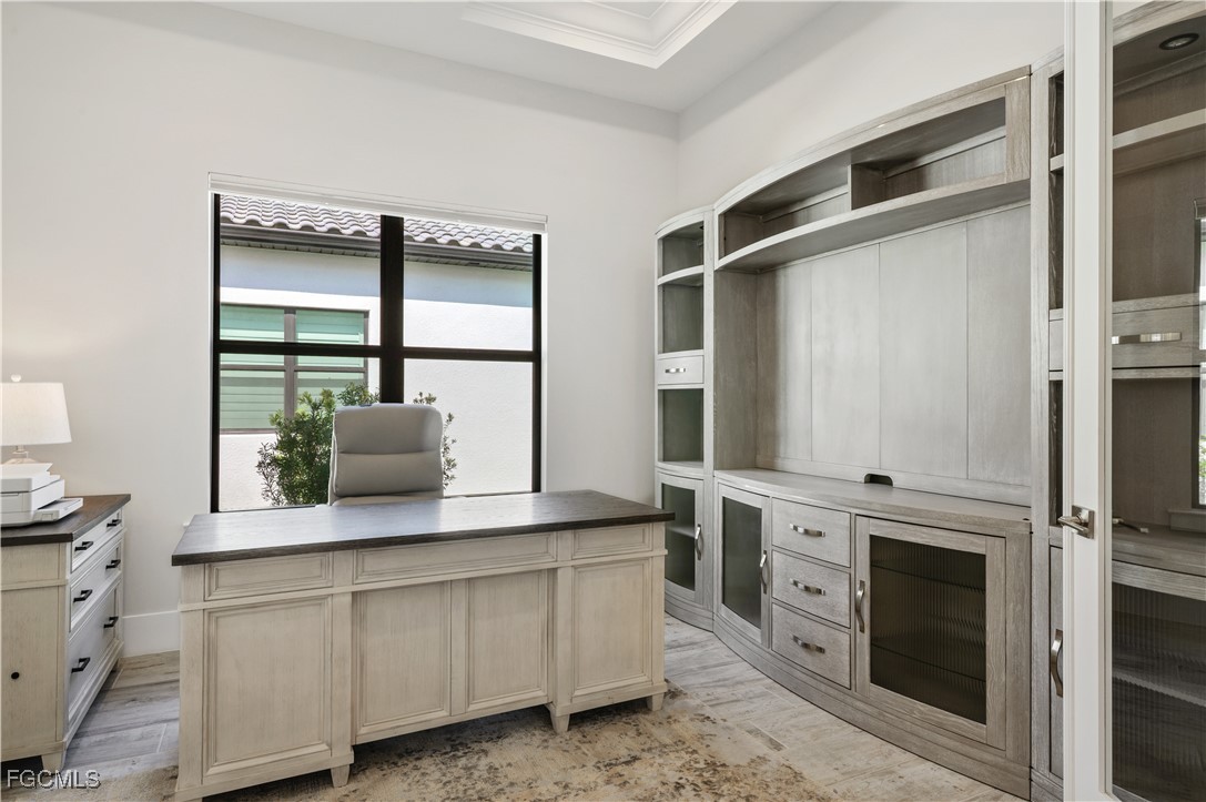 18377 Ridgeline Drive Estero, FL 33928 - Photo 30 of 50 a kitchen with white cabinets and white appliances