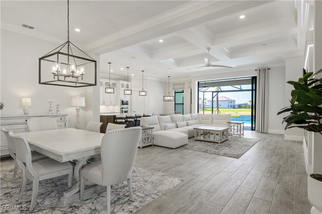 18377 Ridgeline Drive Estero, FL 33928 - Photo 3 of 50 a living room with furniture wooden floor and a chandelier