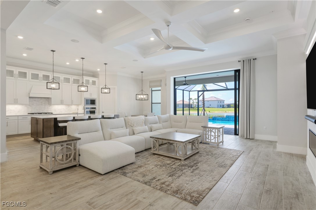 18377 Ridgeline Drive Estero, FL 33928 - Photo 4 of 50 a living room with furniture and a large window