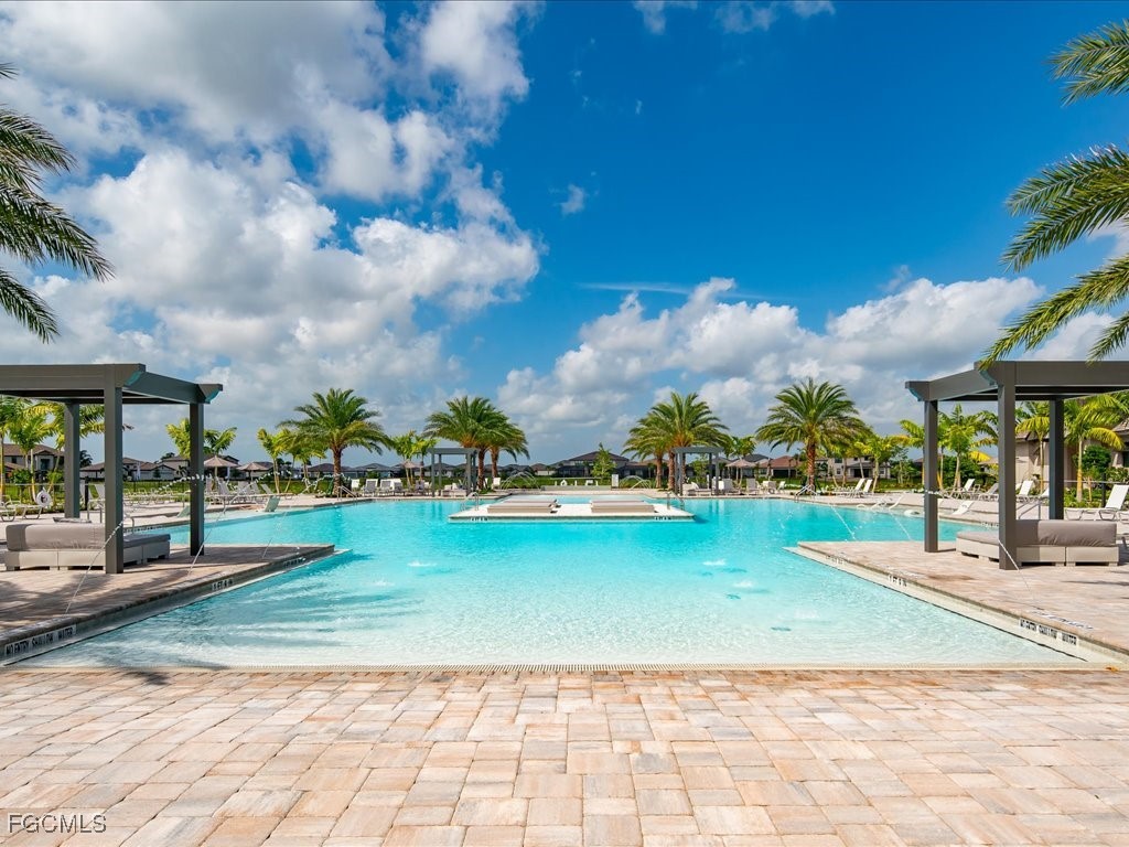18377 Ridgeline Drive Estero, FL 33928 - Photo 45 of 50 a view of a swimming pool with an outdoor seating