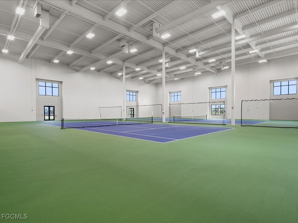 18377 Ridgeline Drive Estero, FL 33928 - Photo 46 of 50 a living room with furniture and a flat screen tv