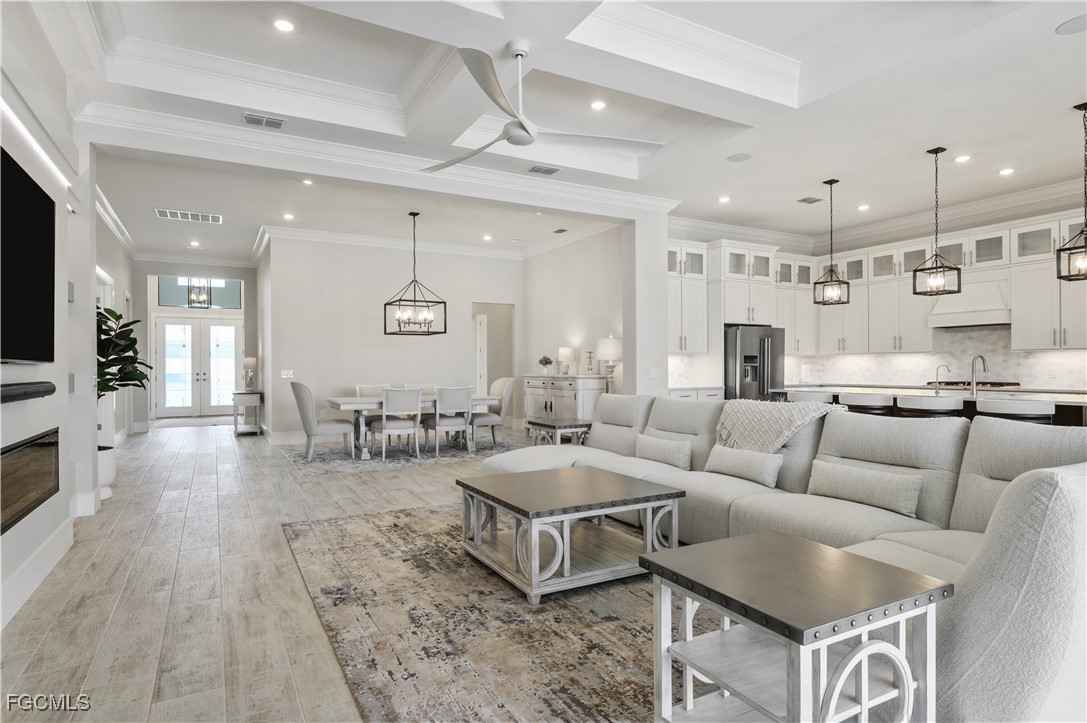 18377 Ridgeline Drive Estero, FL 33928 - Photo 5 of 50 a living room with furniture and kitchen view