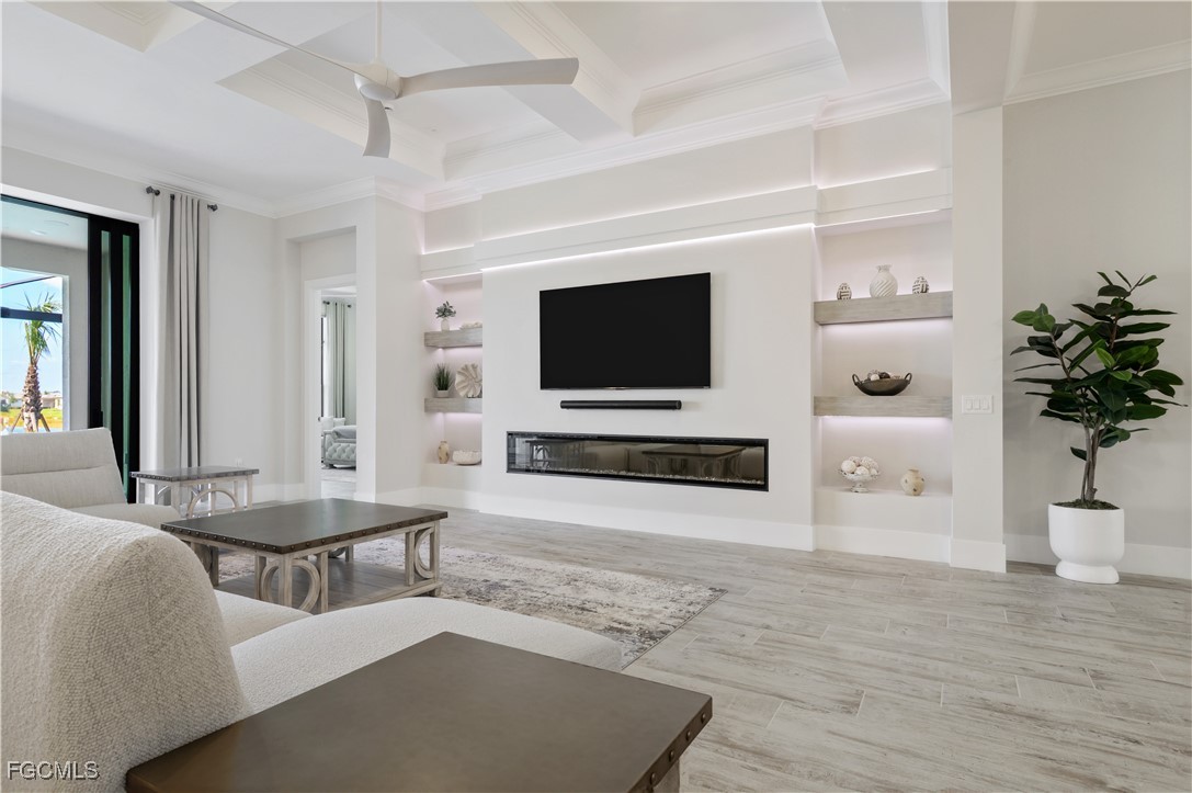 18377 Ridgeline Drive Estero, FL 33928 - Photo 6 of 50 a living room with furniture and a flat screen tv