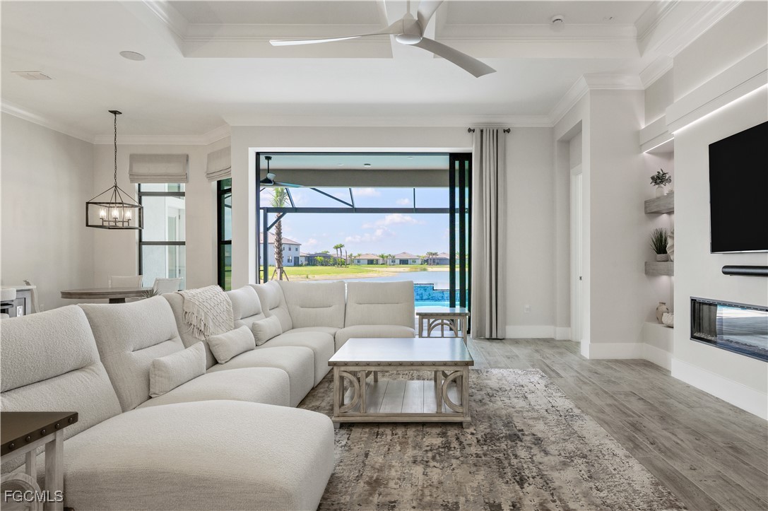 18377 Ridgeline Drive Estero, FL 33928 - Photo 7 of 50 a living room with furniture and a flat screen tv