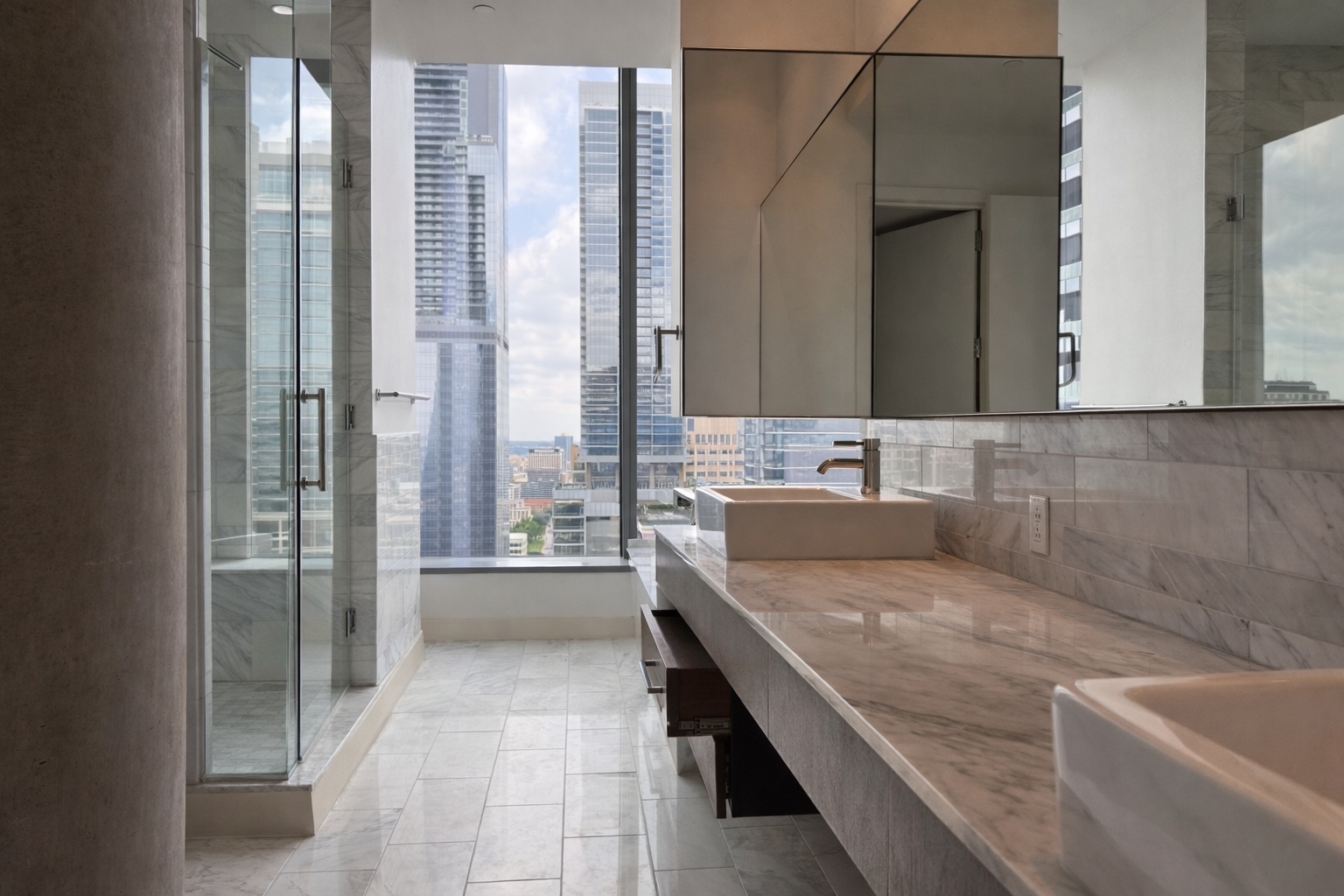 210 Lavaca Street, Unit 2808 Austin, TX 78701 - Photo 14 of 32 a bathroom with a granite countertop sink a mirror and a shower