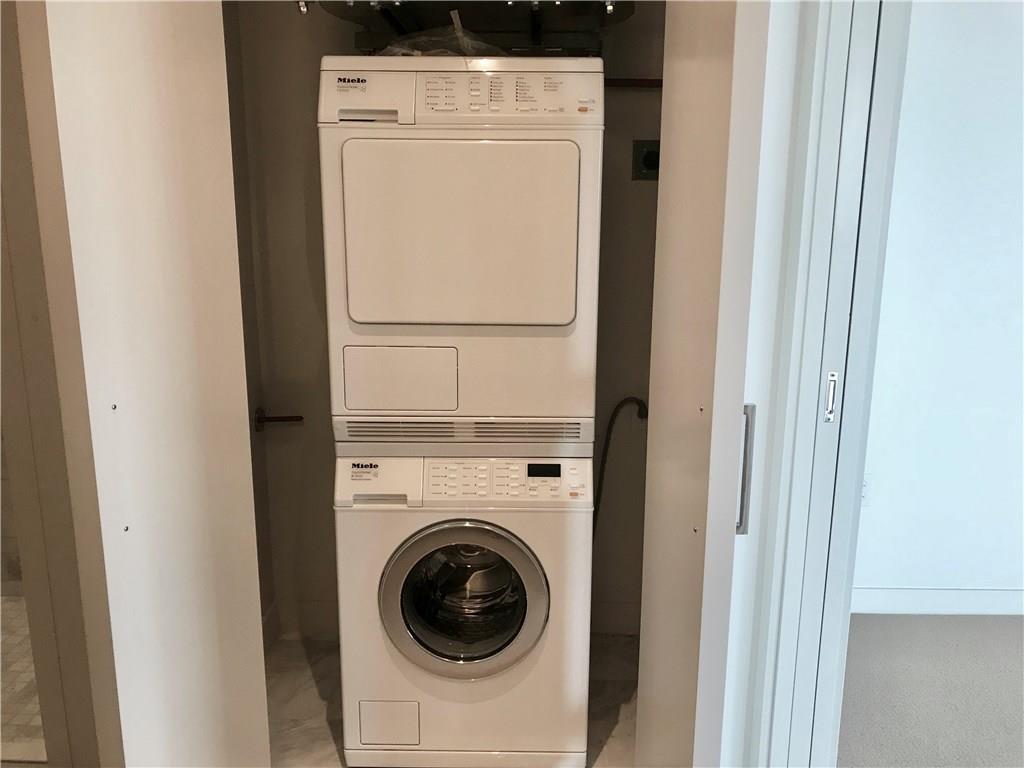 210 Lavaca Street, Unit 2808 Austin, TX 78701 - Photo 21 of 32 Dedicated laundry space featuring a stacked washer and dryer