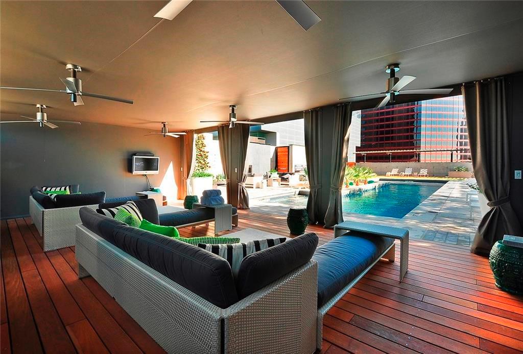 210 Lavaca Street, Unit 2808 Austin, TX 78701 - Photo 29 of 32 a living room with furniture fireplace and flat screen tv