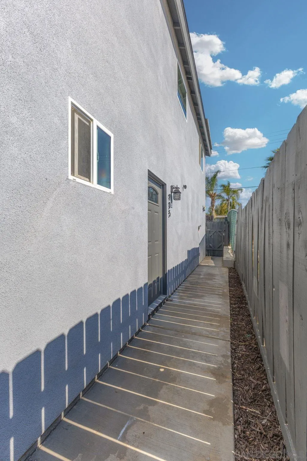 903 Concepcion Avenue Spring Valley, CA 91977 - Photo 11 of 69 a view of a hallway with wooden floor and stairs