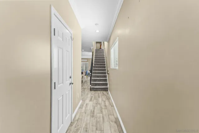 a kitchen with stainless steel appliances white cabinets and a refrigerator