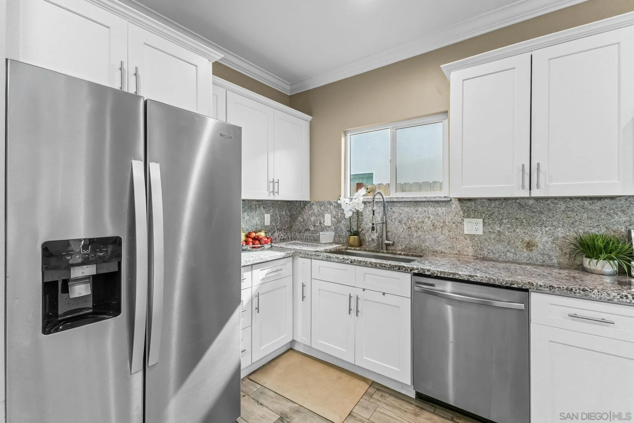 903 Concepcion Avenue Spring Valley, CA 91977 - Photo 17 of 69 a kitchen with stainless steel appliances white cabinets and a refrigerator