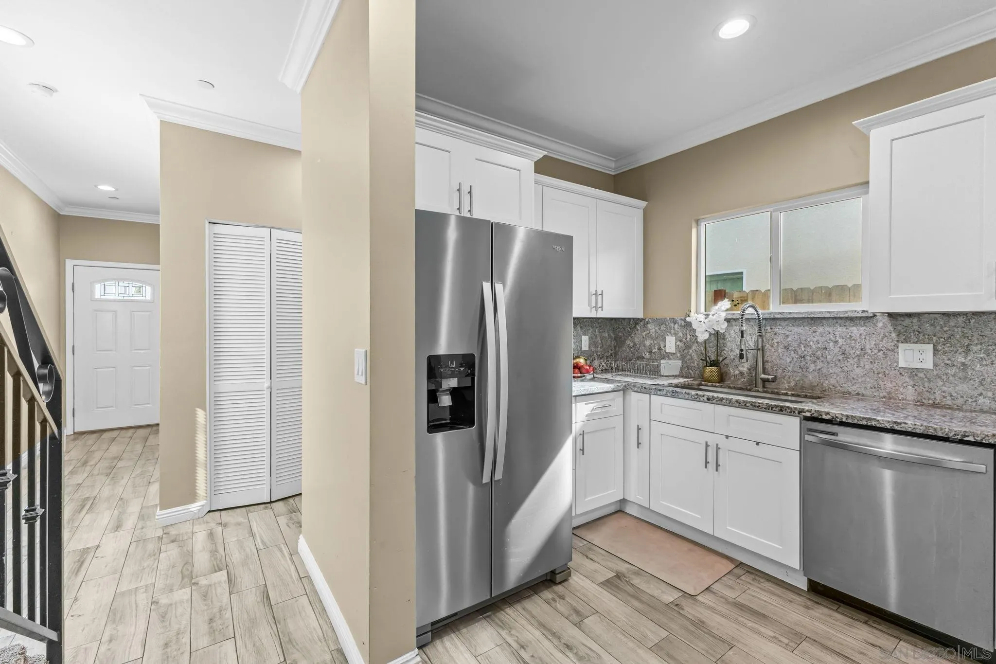 903 Concepcion Avenue Spring Valley, CA 91977 - Photo 18 of 69 a kitchen with stainless steel appliances granite countertop a refrigerator and a sink