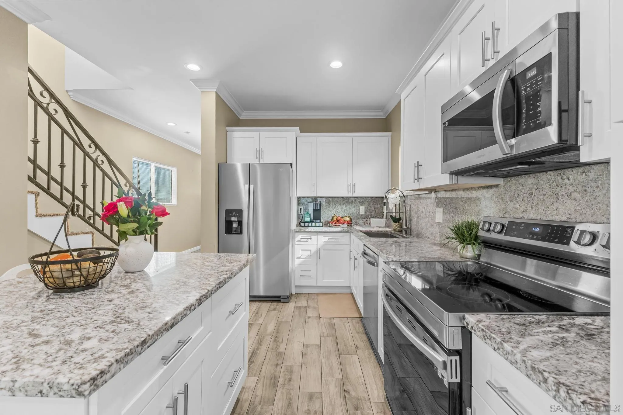 903 Concepcion Avenue Spring Valley, CA 91977 - Photo 19 of 69 a kitchen with stainless steel appliances granite countertop a sink stove and refrigerator