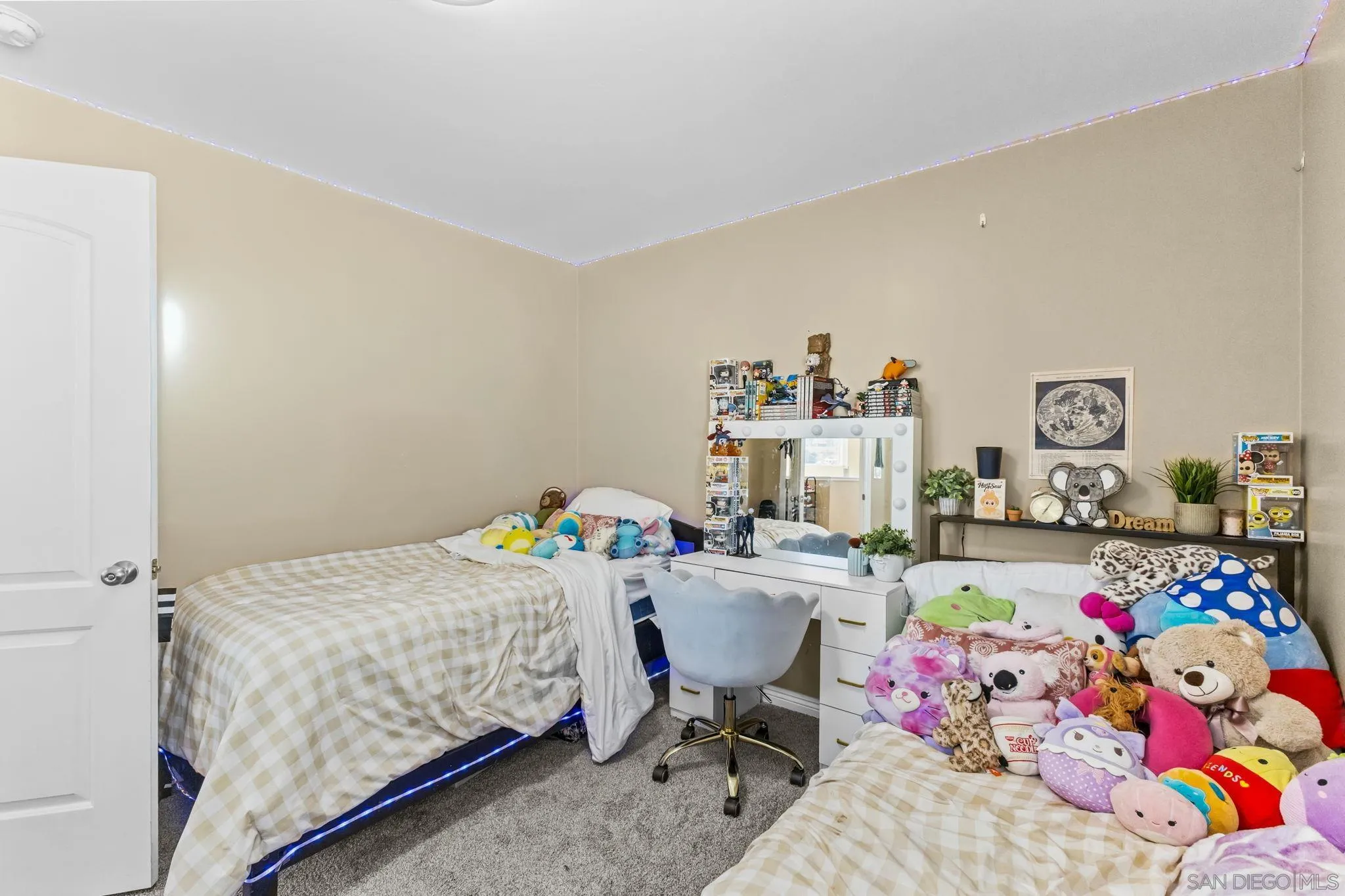 903 Concepcion Avenue Spring Valley, CA 91977 - Photo 32 of 69 a bedroom that has a bed and a chair in it